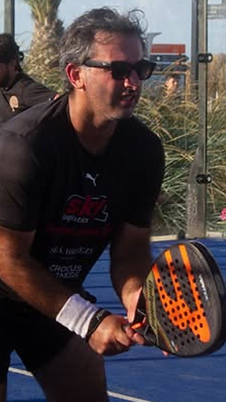 Player returning a shot at Sky Padel Baku