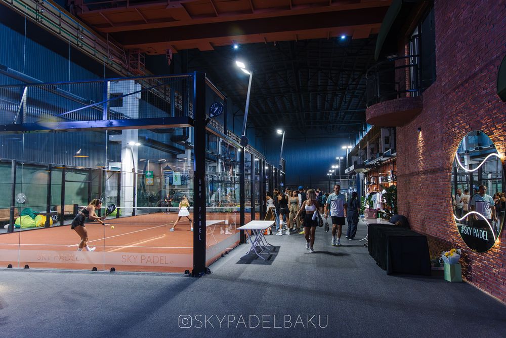 The walkway between the courts and the club shops