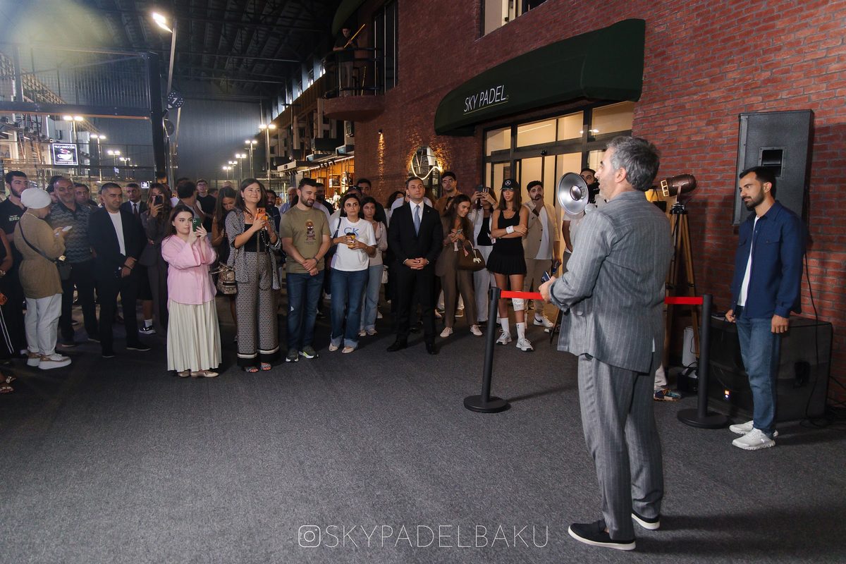 Vugar Astanov addressing guests with a megaphone at the Sky Padel entrance